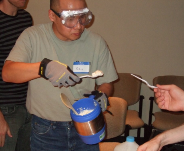 A helper serves liquid nitrogen ice cream